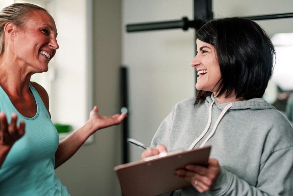 Two women smiling after training